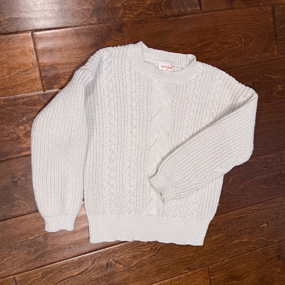 Girls cable knit sweater.